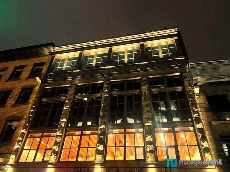 Side view of large buildings lighting at night