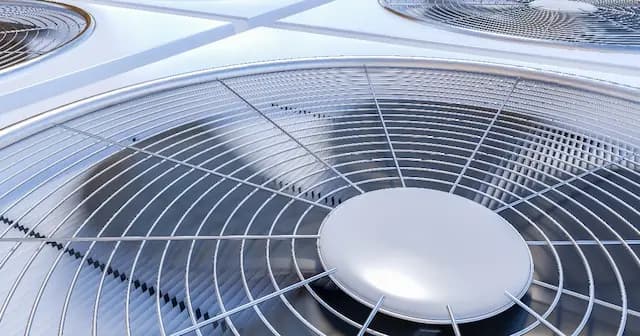 Close up of the fan of an external air conditioning unit.
